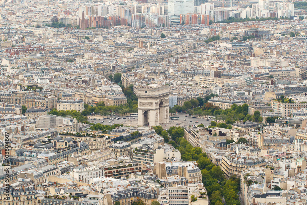 Color DSLR wide angle stock skyline of Paris, France, with the Arc de Triomphe at the center. Urban scene shot from top of Eiffel Tower. Horizontal with copy space for text.