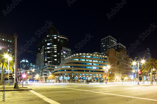 city road with cityscape of San Francisco at night © zhu difeng