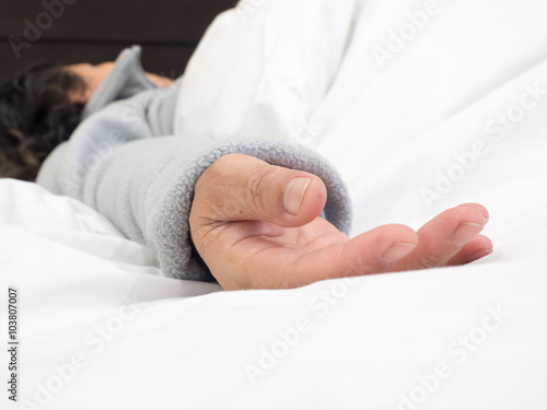 closeup senior woman's hand sleeping in the bed