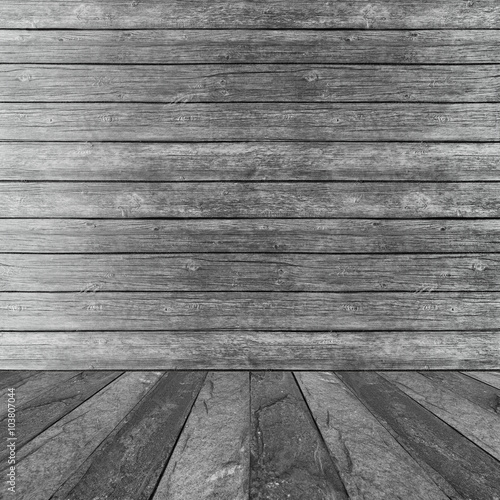 concrete floor and wood wal...
