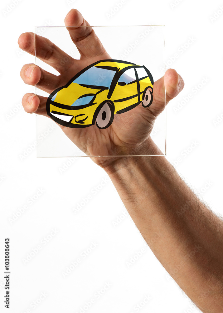 Fototapeta premium Hand holding glass picture of car
