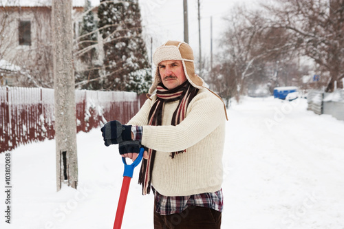 angry man clears snow