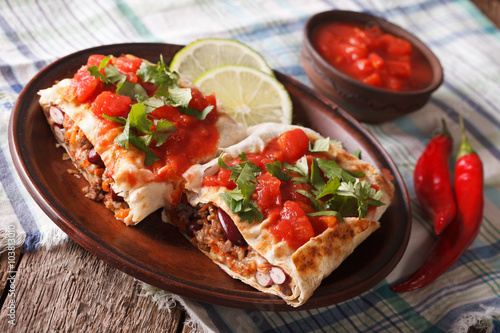 chimichanga with minced meat, vegetables and cheese close-up horizontal 