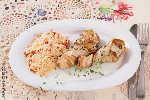 chicken legs in fat with couscous