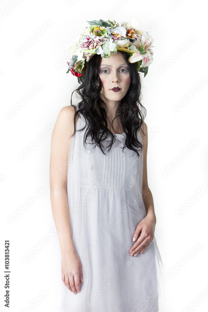 Portrait of Young Woman with Wreath of Flowers on white Background. Beauty Concept. 