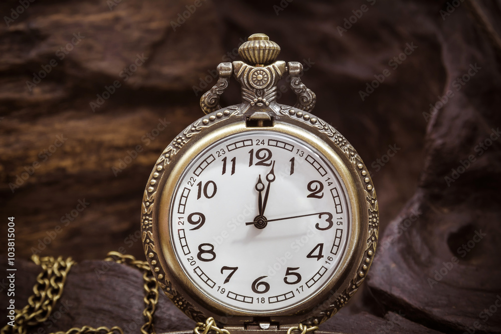 Retro pocket watch ancient on wood. vintage style. close up