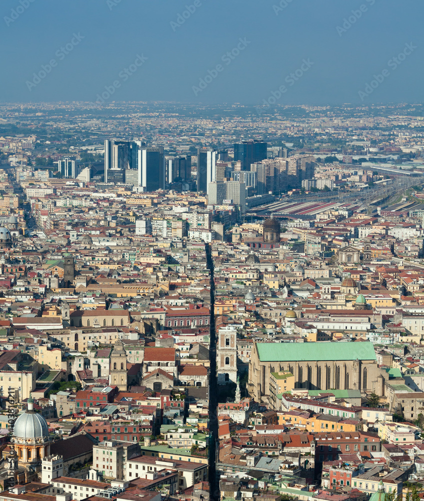 Panorama of Naples - view of Spaccanapoli street splitting city center; business district Centro Direzionale skyscrapers are in the background