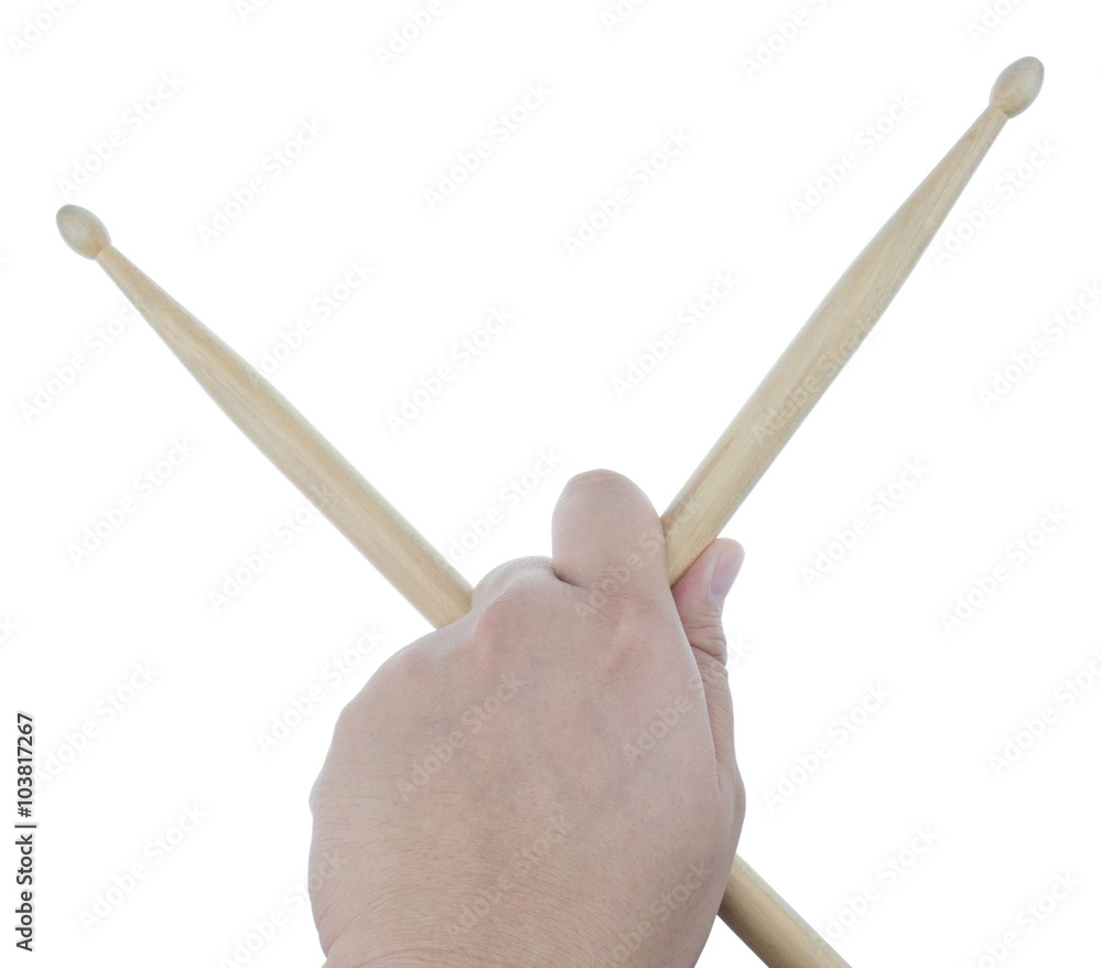 Isolated male left hand holding drum sticks Isolated male left hand holding drum sticks