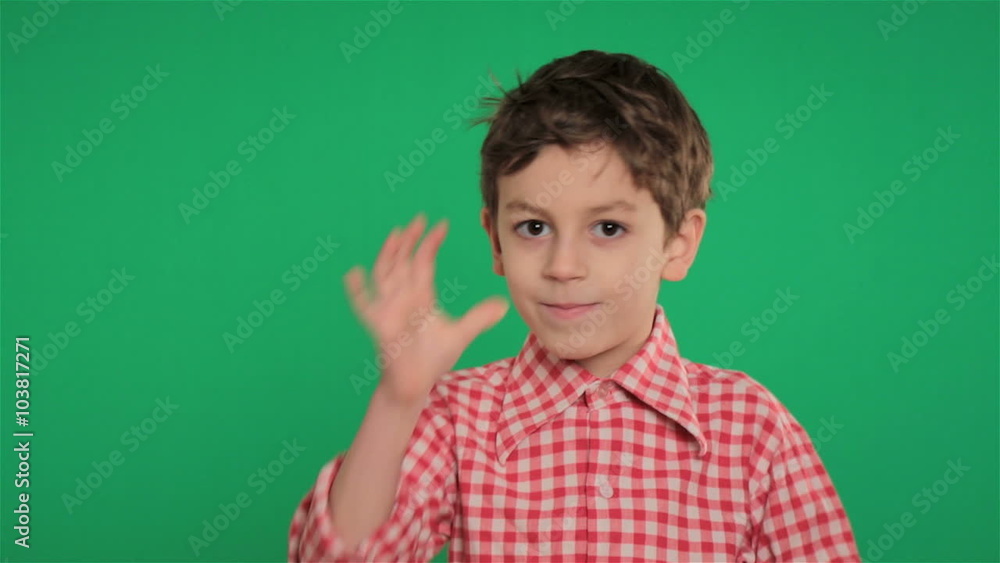 young boy making funny gesture on green screen young boy making funny gesture on green screen
