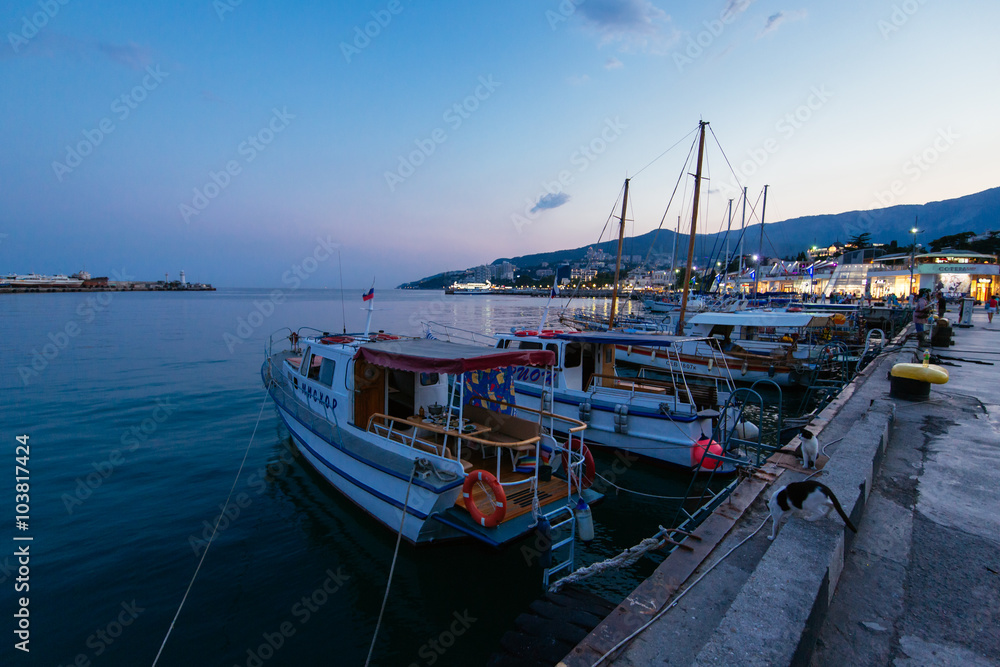 boat at the pier on the waterfront at Yalta evening