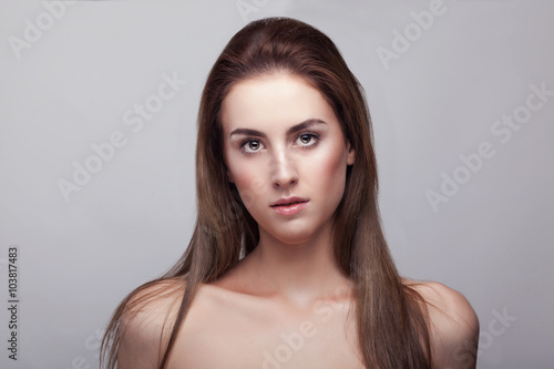 Woman with natural make up on grey background