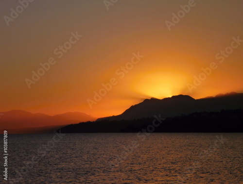 beautiful romantic sunrise at lago villarica in chile
