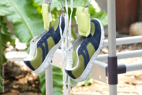 right shoe tongue (selected focus) of green and deep blue canvas
