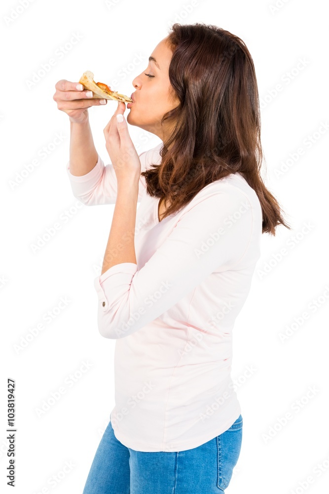 Casual woman eating a slice of pizza Casual woman eating a slice of pizza