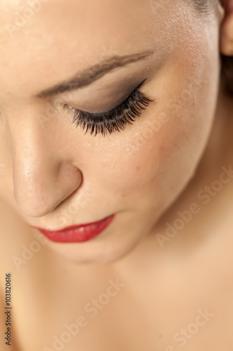 Portrait close-up on a woman's face - artificial eyelashes