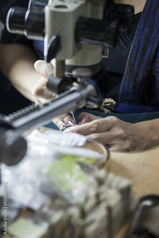 Obraz premium jewelry making by microscope