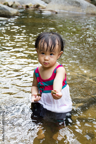 Fototapeta Naklejka Na Ścianę i Meble -  Asian Little Chinese Girl Playing in Creek