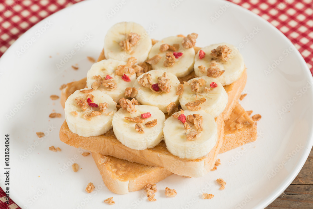A healthy peanut butter and banana sandwich, muesli crisp with berry. A healthy peanut butter and banana sandwich, muesli crisp with berry.