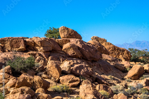 Granite rocks under blue sky © ondrejt
