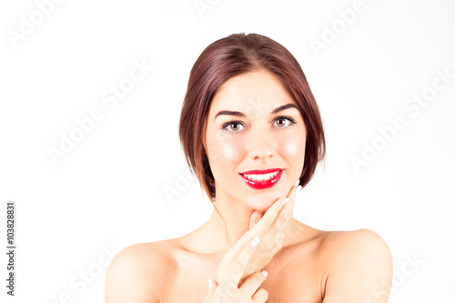 Woman with a perfect smile with white teeth. Sexy woman with red lips touching chin.
