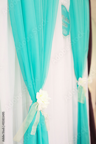 Green curtain background.
