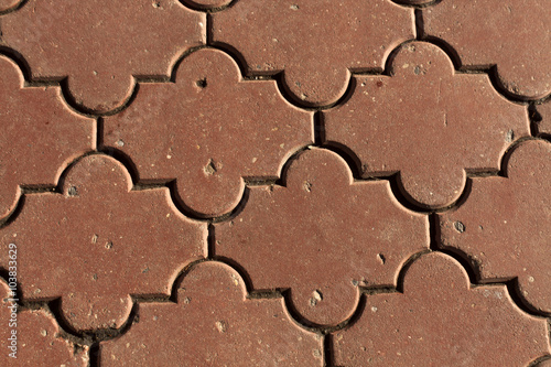 Red color pavement closeup. Architectural background.