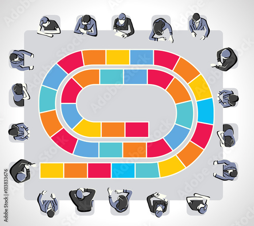 Colorful meeting table with business people around a board game path.

