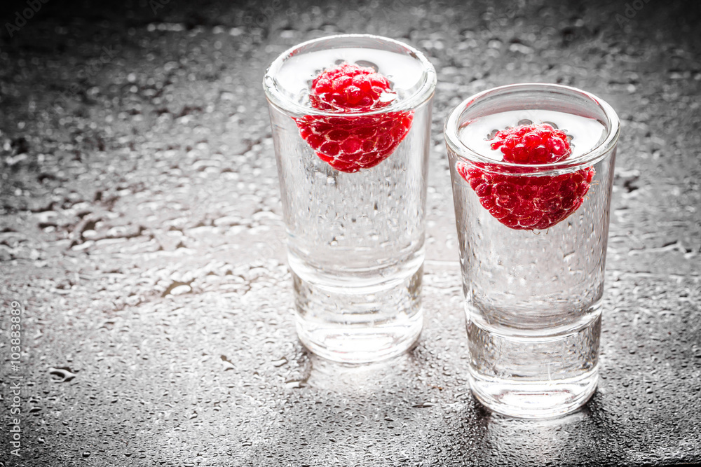 Raspberry vodka glass shot with fruit inside. Raspberry vodka glass shot with fruit inside.