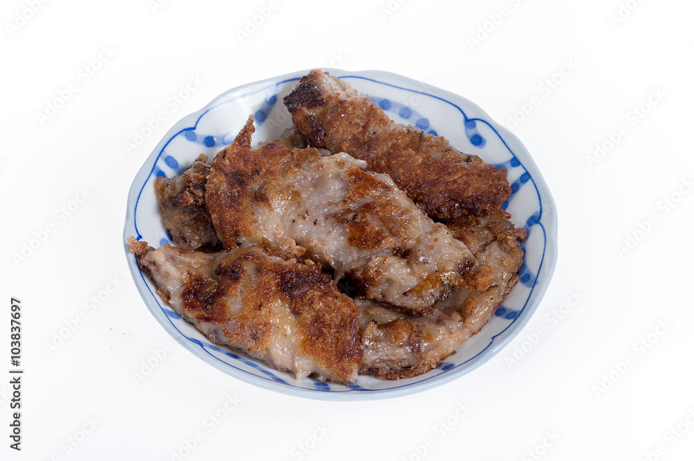 Taro Cake on a plate isolated on white background
Taro Cake on a plate isolated on white background