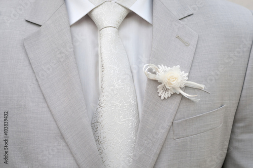 Groom gray jacket with white flower