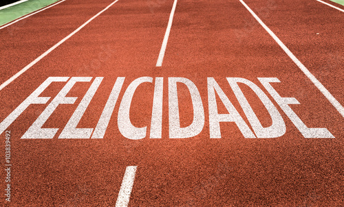 Happiness (in Portuguese) written on running track