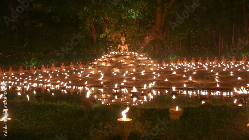 Magha puja day, Monks light the candle for buddha, Chiangmai,Thailand photo