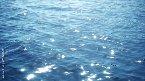 sun reflections at the water surface in slow motion