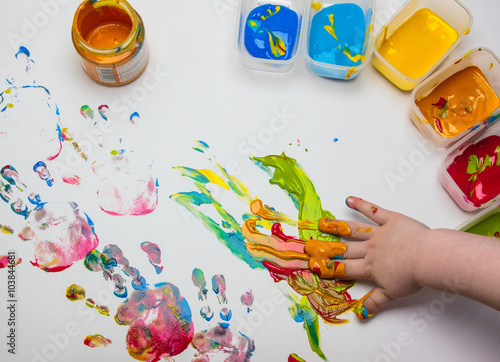 Abstract picture drawn by a child's palm on a paper