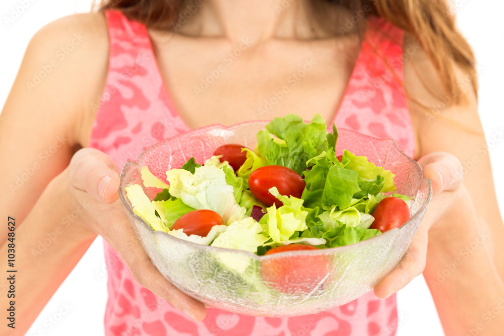 Female hands holding a salad bowl
