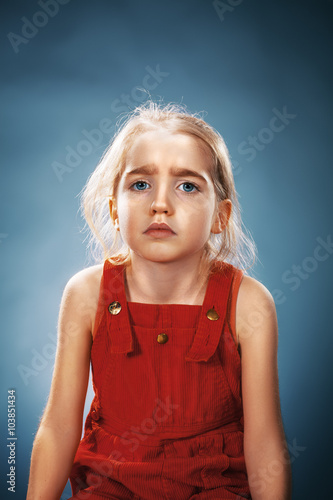 Beautiful portrait of a thoughtful little girl 