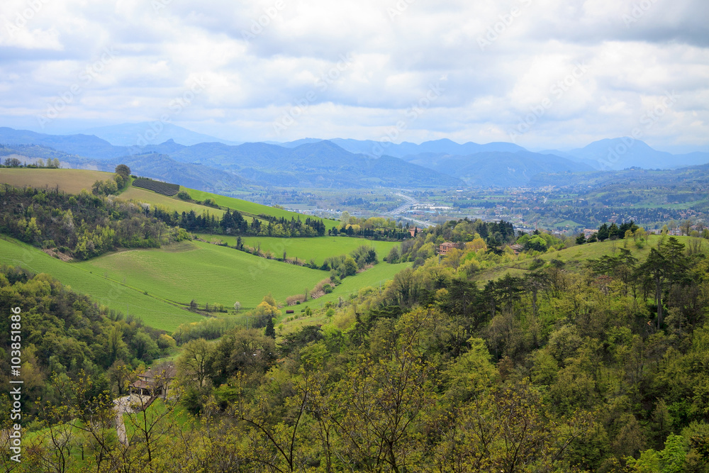 Obraz premium Aerial view to the green hills, forest and town nearby Bologna town 