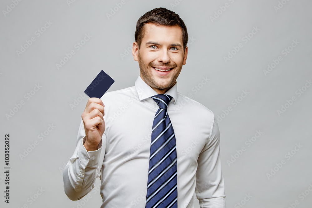 Handsome stylish businessman on grey background Handsome stylish businessman on grey background
