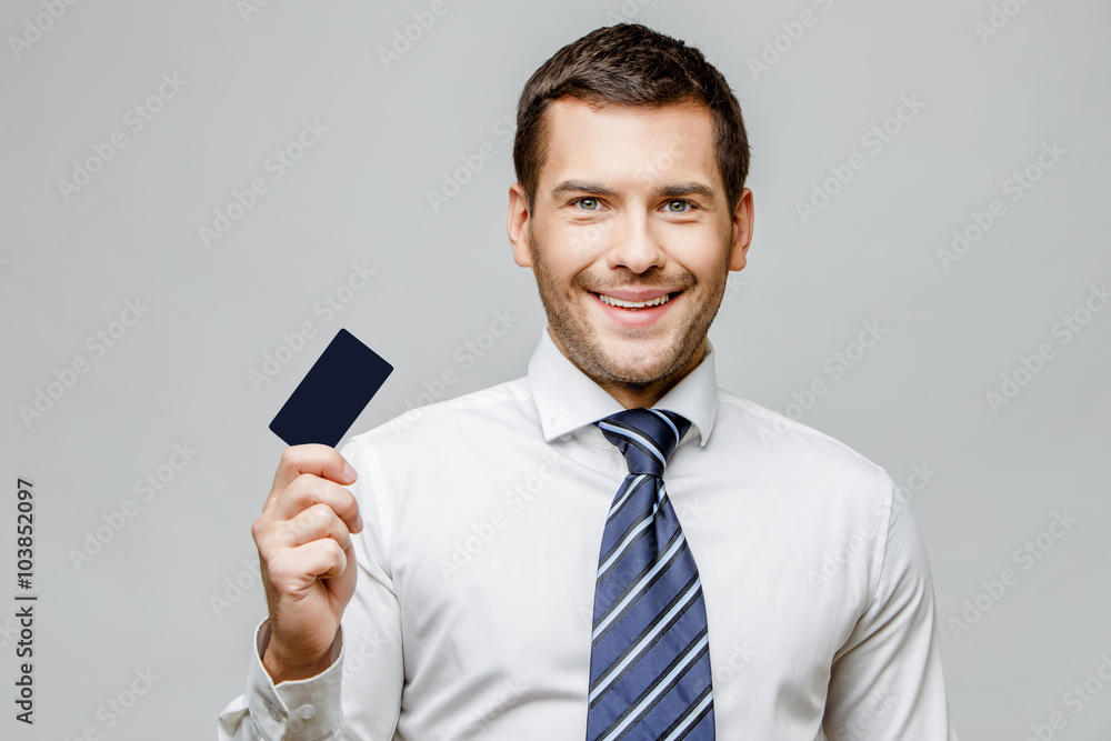 Handsome stylish businessman on grey background Handsome stylish businessman on grey background
