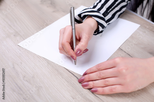 Beautiful Caucasian woman dreams about something, sitting with a laptop net book isolated white background charming young female freelancer thinking about new ideas while working on laptop