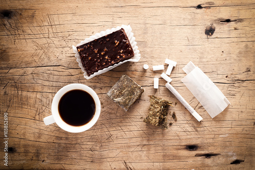 weed marijuana hashish roll wood background