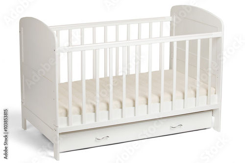White wooden baby crib isolated on white background photo