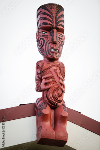 Traditional Maori carving sculpture of a man in Rotorua park, North Island, New Zealand