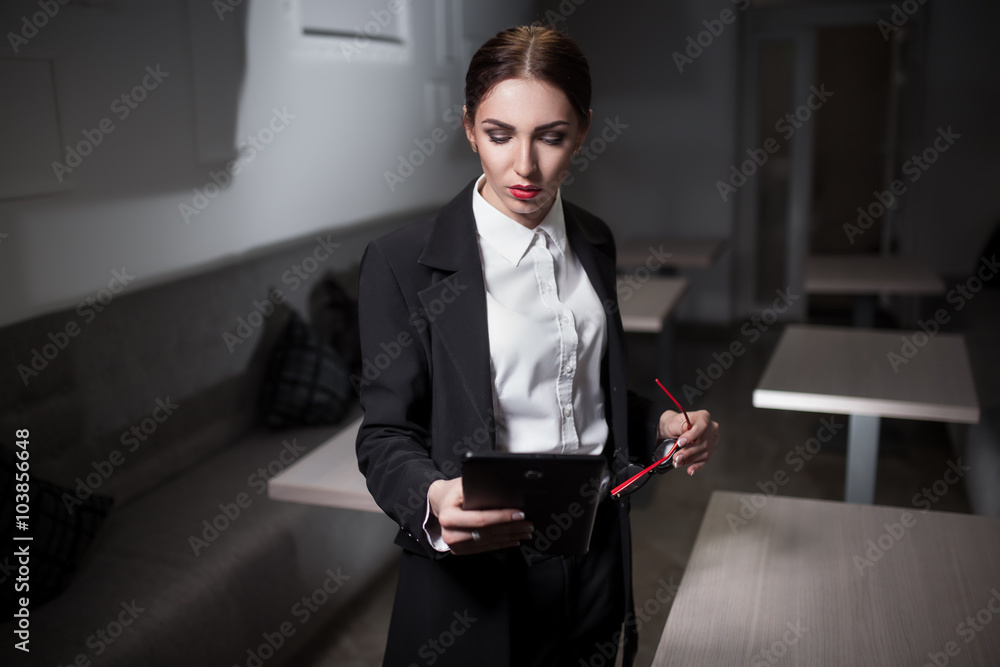 businesswoman in suit and with red lips and with tablet; businesswoman in suit and with red lips and with tablet;