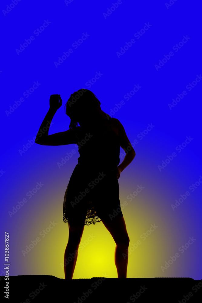 silhouette of woman in short dress arm up