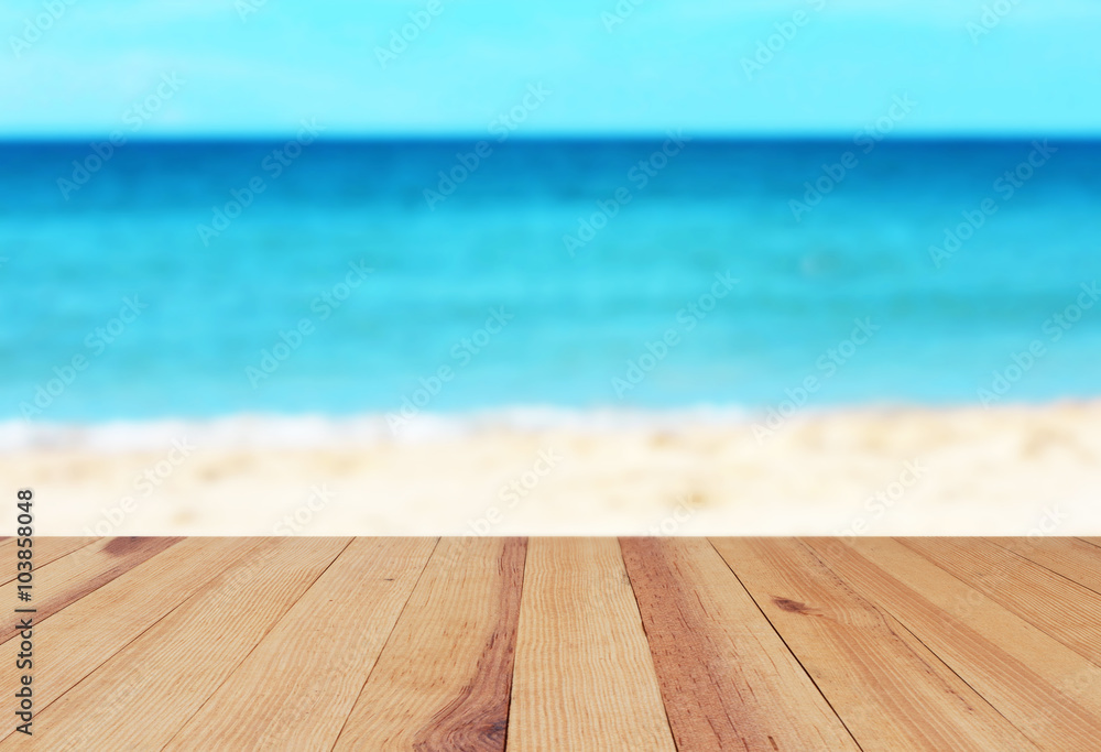 Wood table on blurred beach background Wood table on blurred beach background