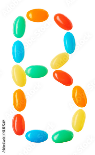 B letter made of multicolored candies isolated on white
