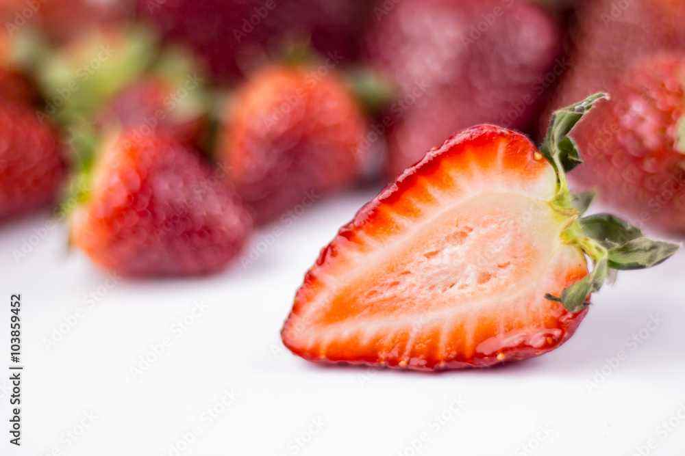 Half of strawberry isolated on white background Half of strawberry isolated on white background