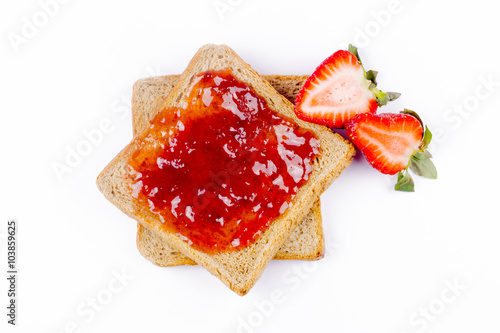 sweet strawberries jam on toast close up