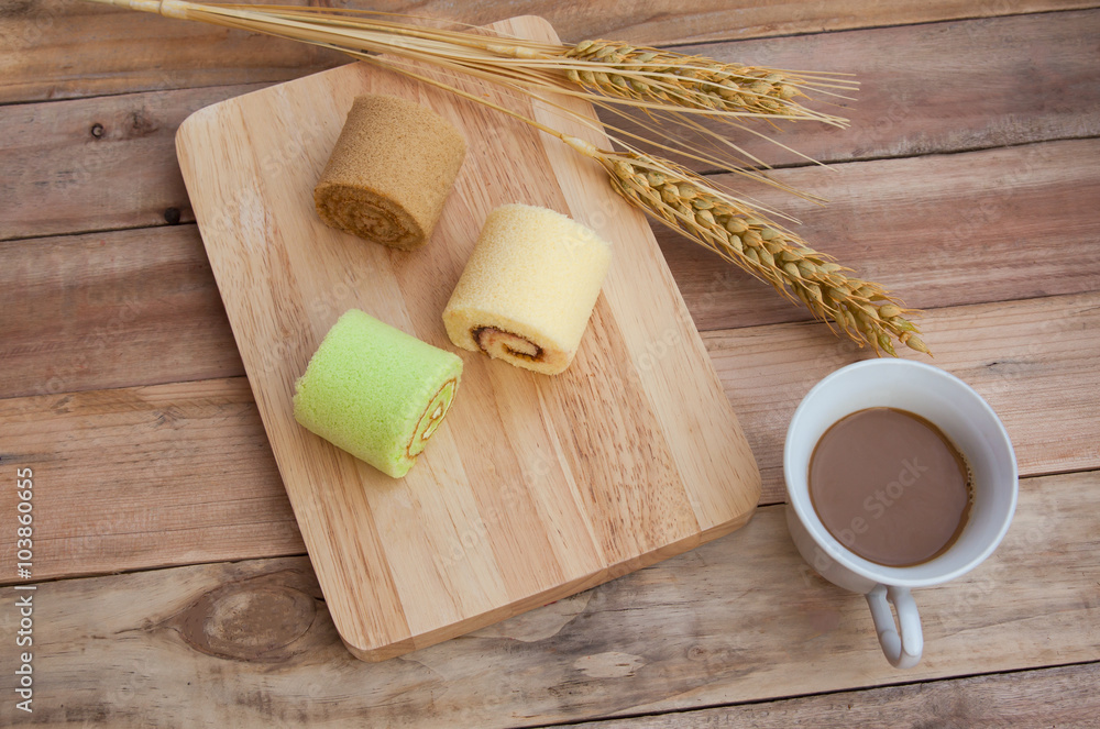 Roll pastry turnovers on a wooden coffee barley background. Roll pastry turnovers on a wooden coffee barley background.